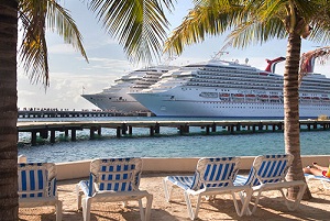 Two cruise ships docked at a Caribbean port